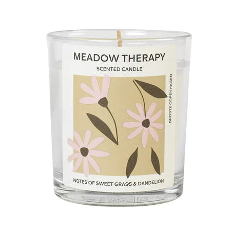Meadow Therapy scented candle with floral label on a white background