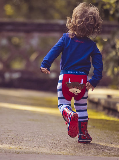 blue and grey striped leeggings with a highland cow face on the bottom